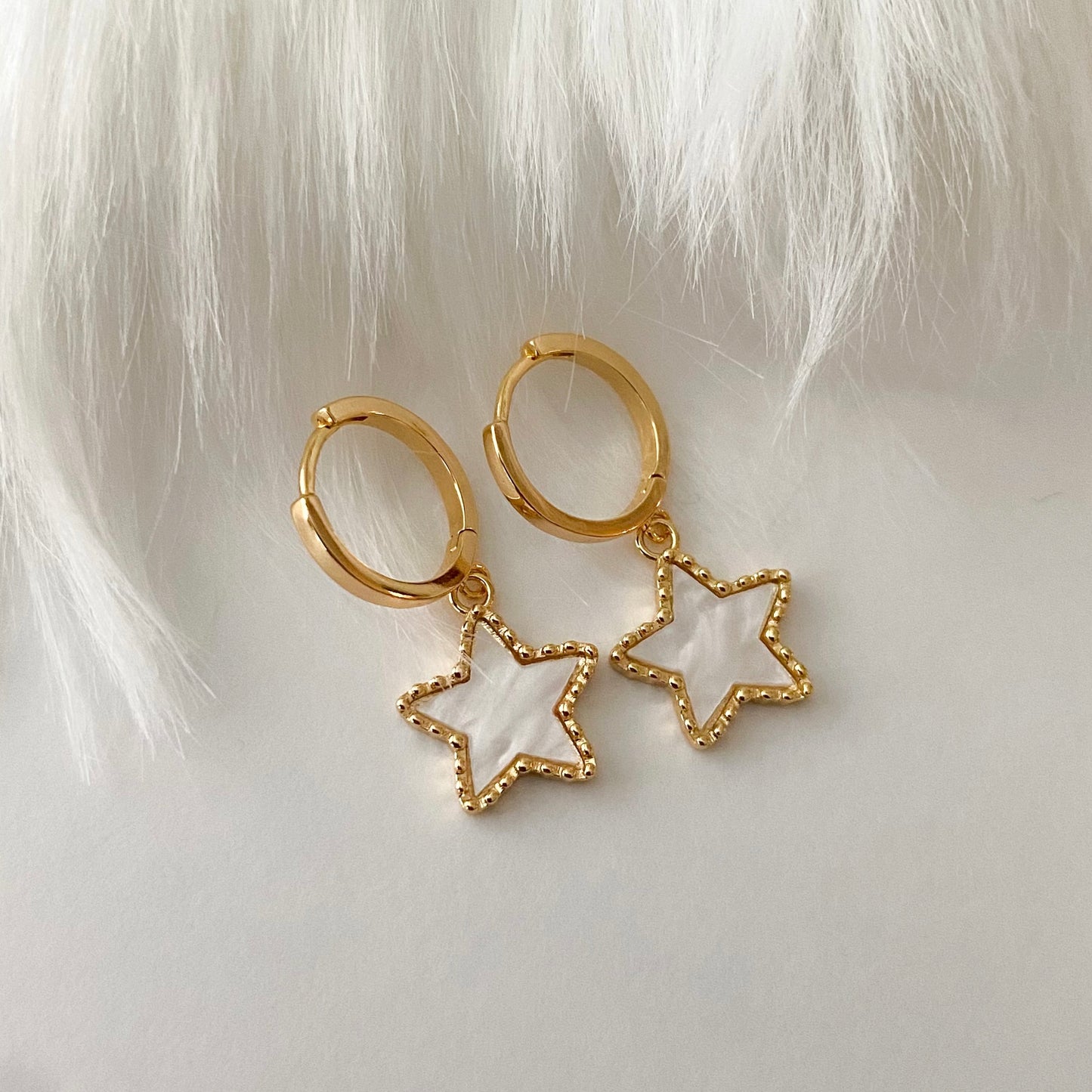 Gold star earrings