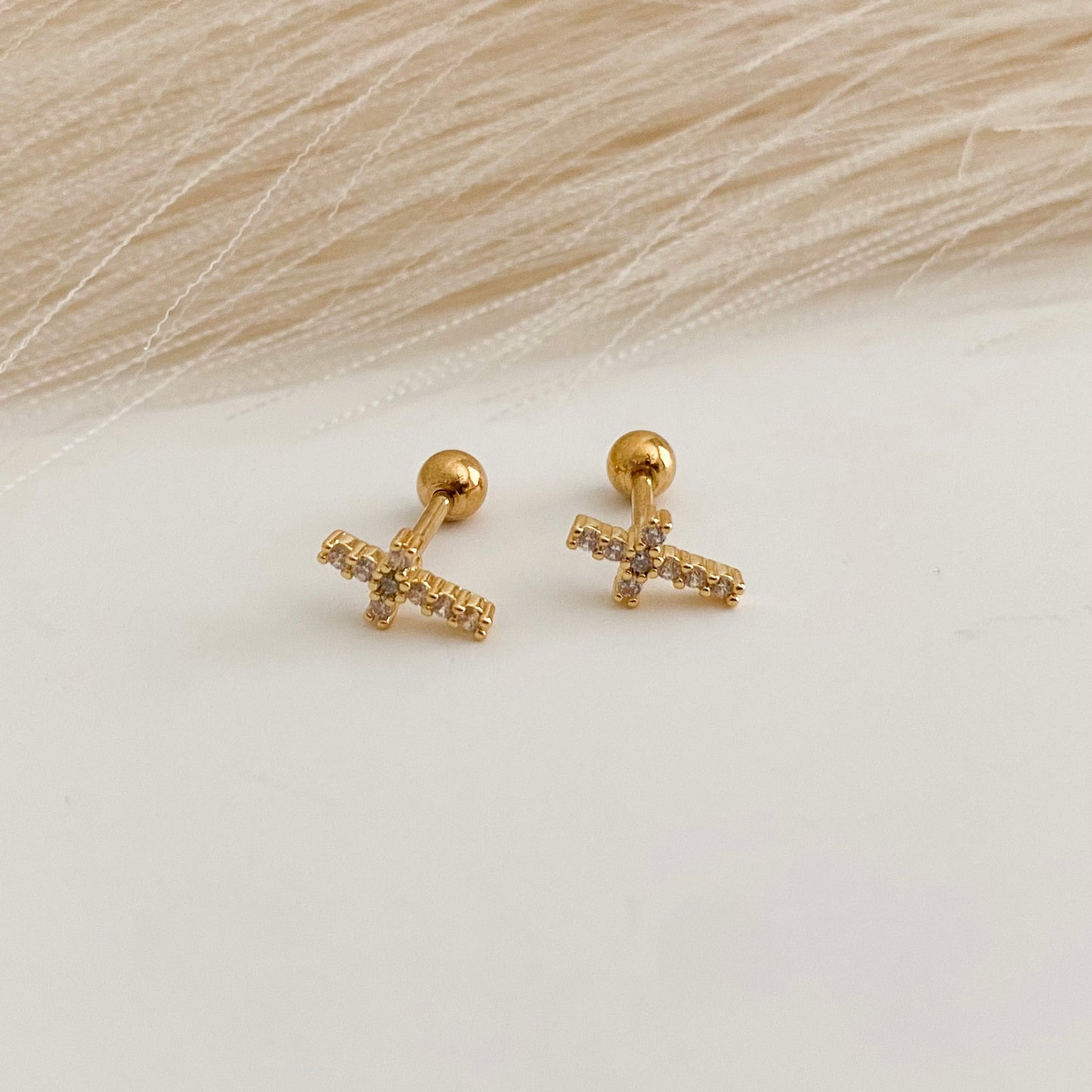 Cross piercings